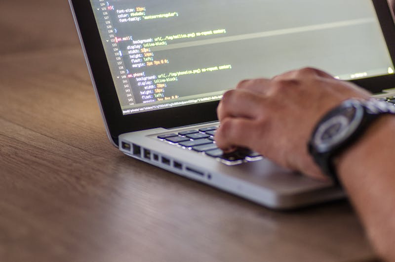 Developer writing rank tracking code on dark terminal