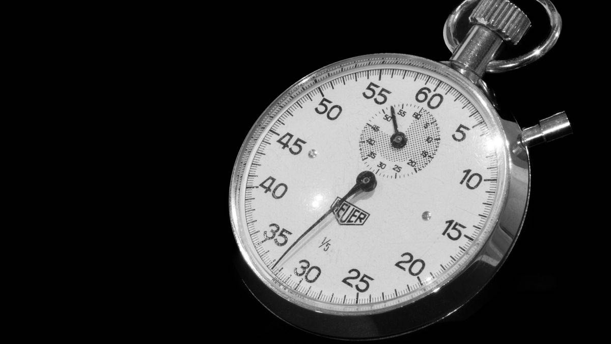 A vintage mechanical stopwatch on a black background — benchmarking the fastest Python HTML parser