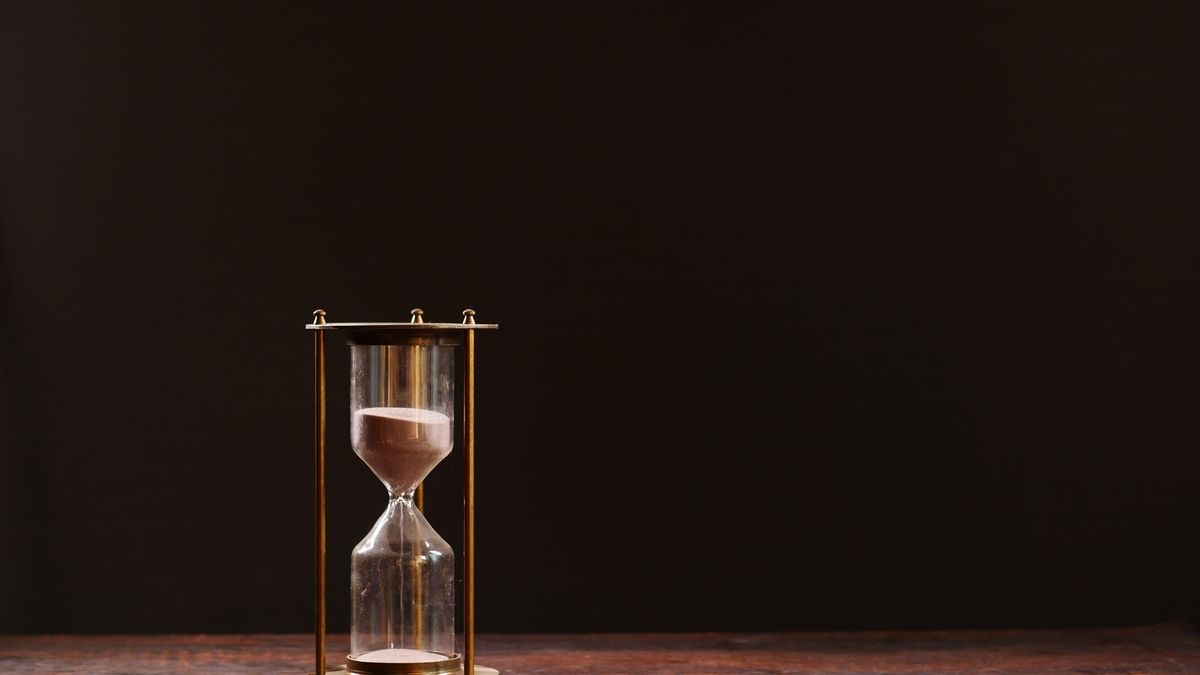 An hourglass with sand running out — the Custom Search API's January 2027 deadline