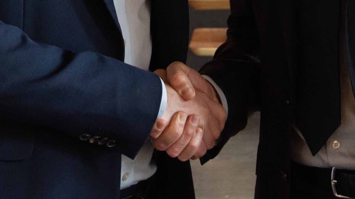 Two professionals meeting to discuss a relevant website project
