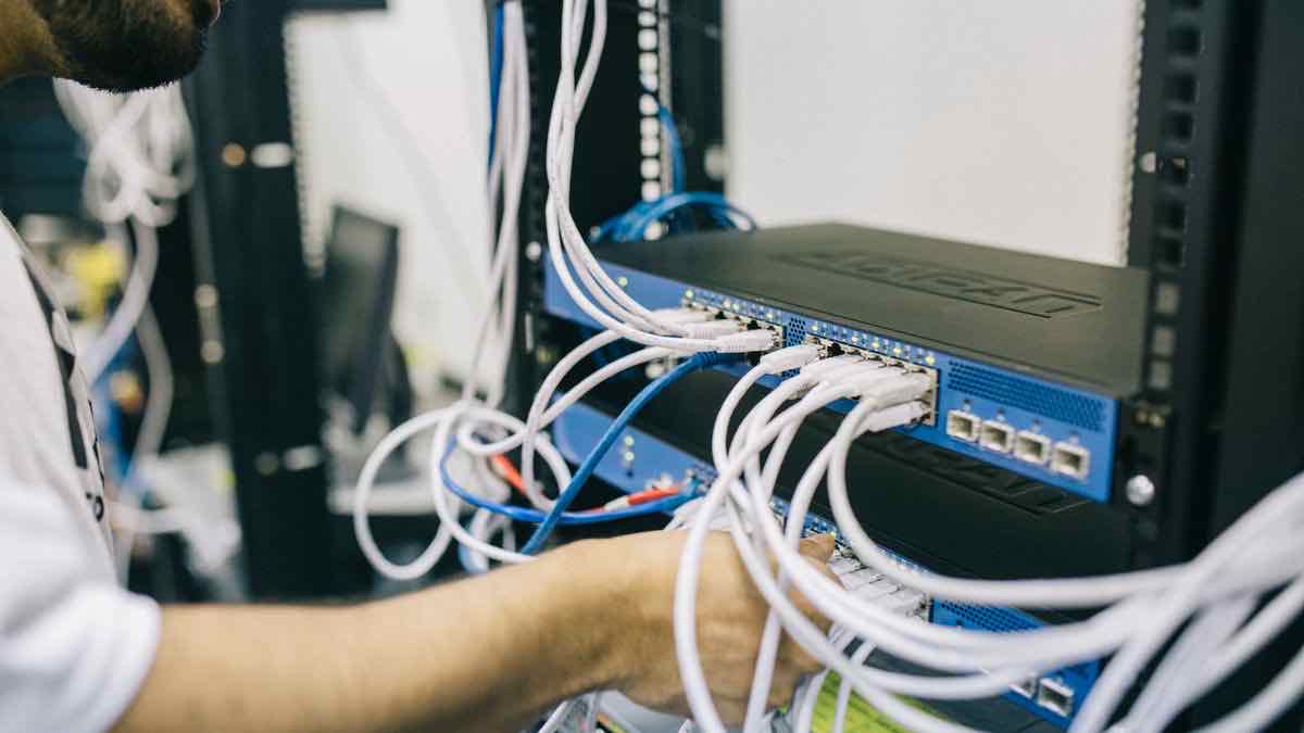 A dense bank of network cabling and switch ports — the tightly governed access layer behind an official platform API
