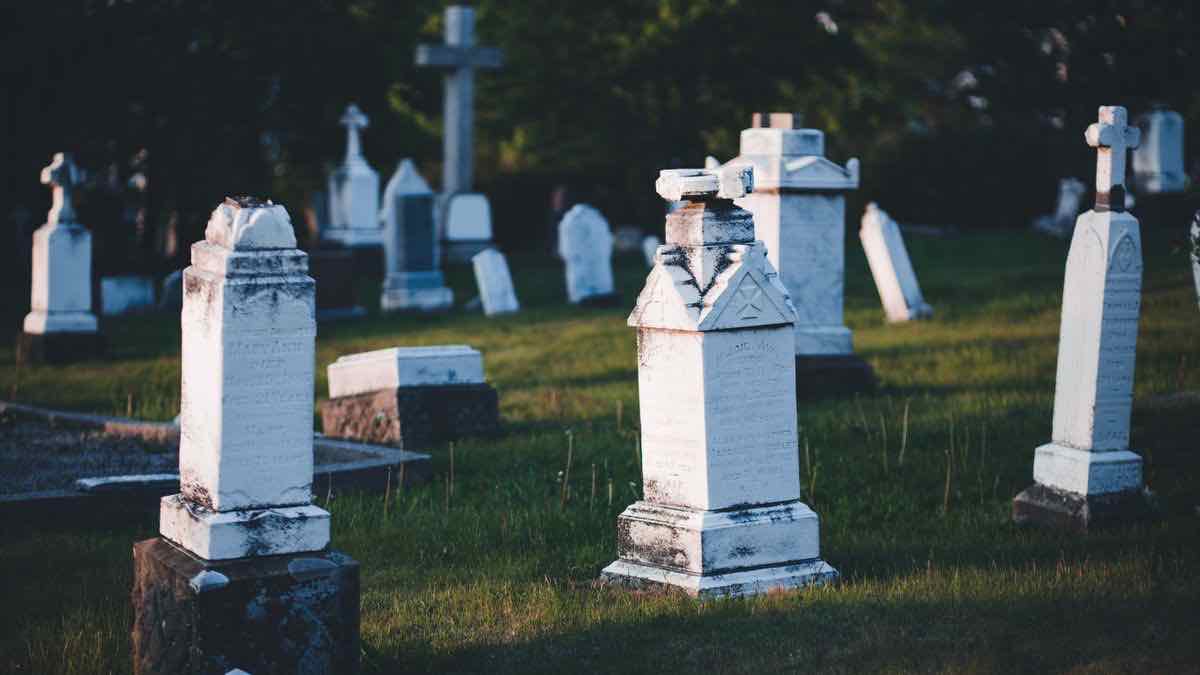 Weathered headstones in a cemetery at dusk — dead Python google search library packages on PyPI