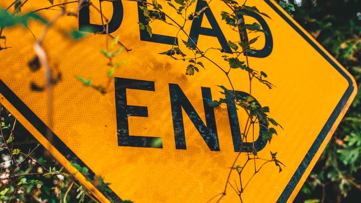 An overgrown yellow DEAD END road sign — the archived pytrends library