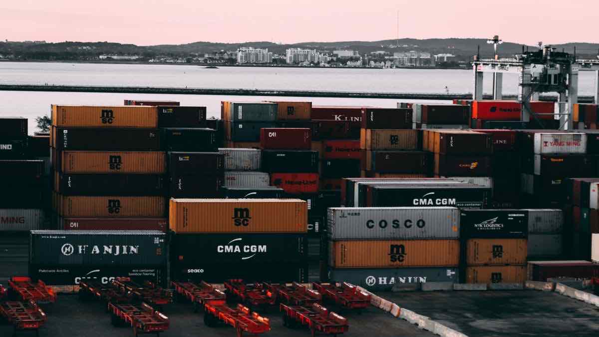 A single red shipping container against a blue sky, a metaphor for running the self-hosted SearXNG SERP API in a Docker container