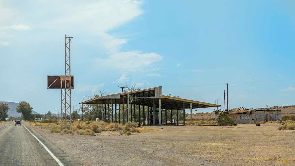 An abandoned desert gas station with empty pumps — rank-tracker providers that no longer serve