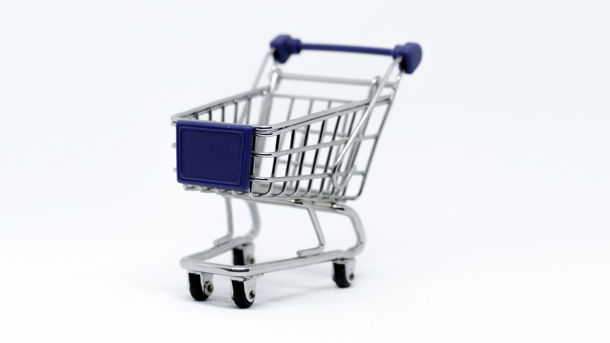 An empty miniature shopping cart on a white background, representing paying for failed API requests